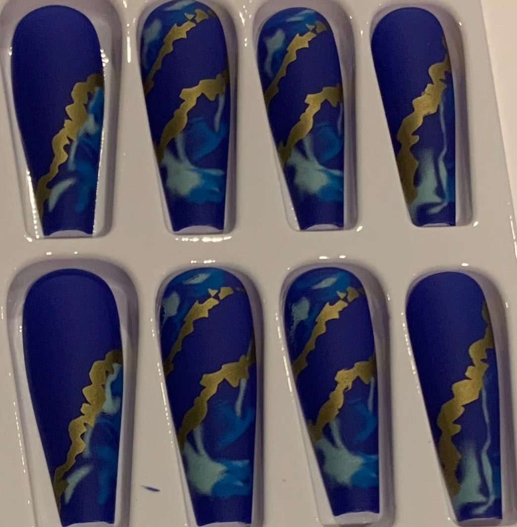 Set of blue and gold nail designs.