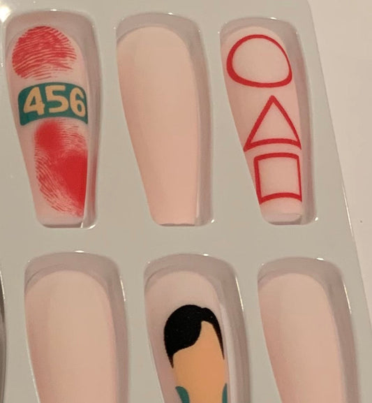 Set of nail art designs with shapes, numbers and a male figure. 